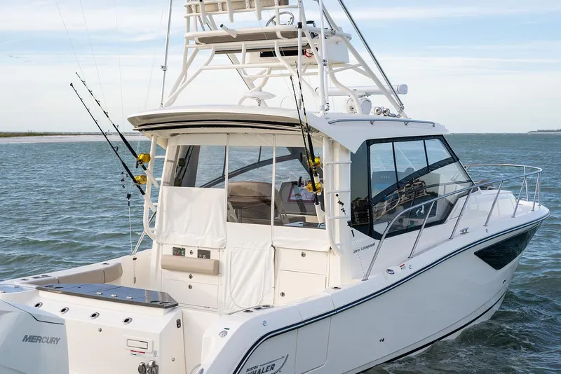 Slide: The Image of Manufacturer Provided Image: 2026 Boston Whaler 365 Conquest cruising on open water, showcasing sleek design and powerful performance. - 5