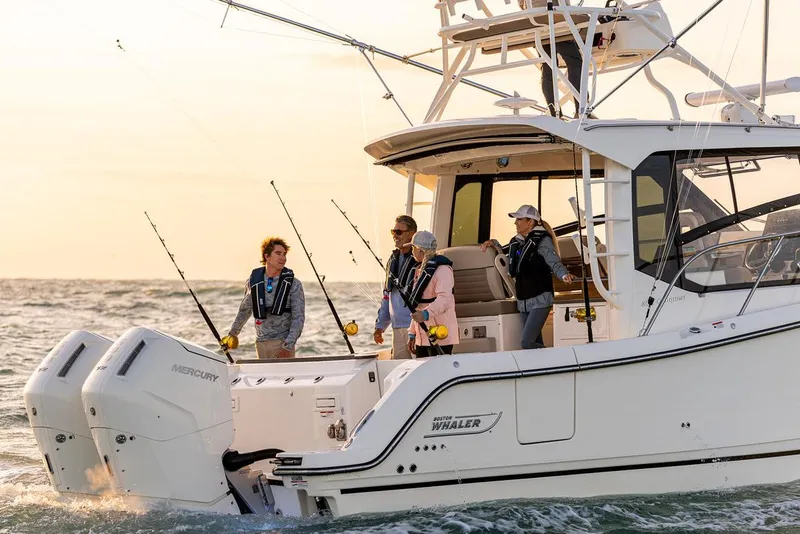 Slide: The Image of Manufacturer Provided Image: 2026 Boston Whaler 365 Conquest cruising on open water at sunset. - 7
