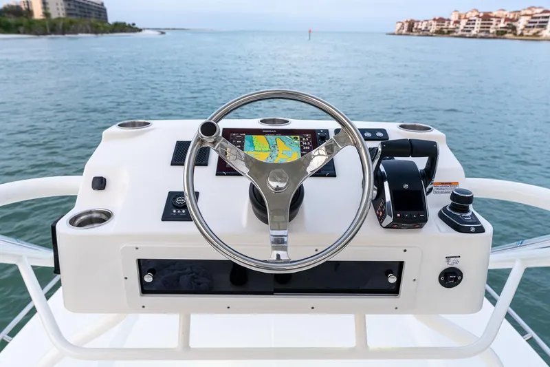 Slide: The Image of Manufacturer Provided Image: 2026 Boston Whaler 365 Conquest boat cruising on calm waters with two people onboard. - 9