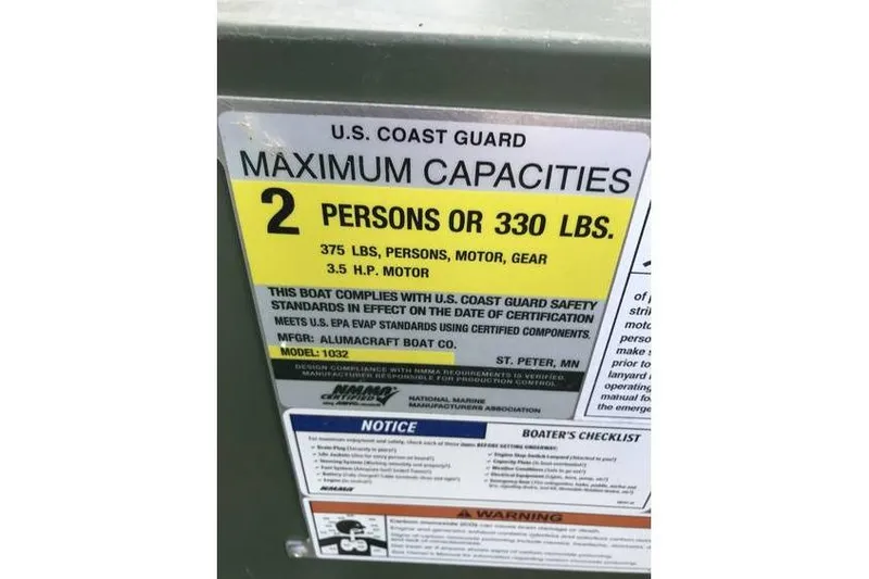 Slide: The Image of 2022 Alumacraft 1032 Jon boat capacity label, 2 persons or 330 lbs, U.S. Coast Guard compliant. - 3