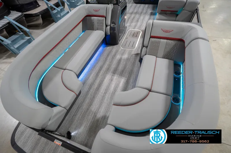 Slide: The Image of Luxurious interior of 2026 Bennington 22 ML pontoon boat with LED lighting and plush seating. - 12