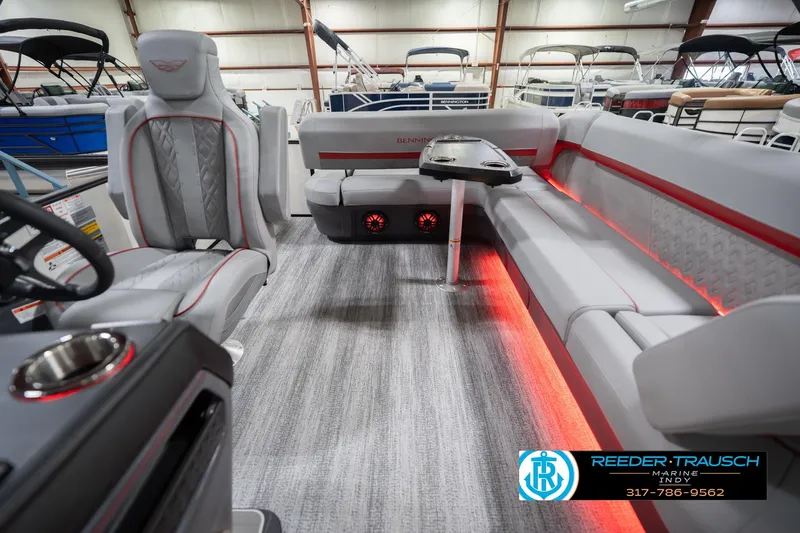 Slide: The Image of 2026 Bennington 22 ML pontoon boat interior with modern seating and ambient lighting. - 17