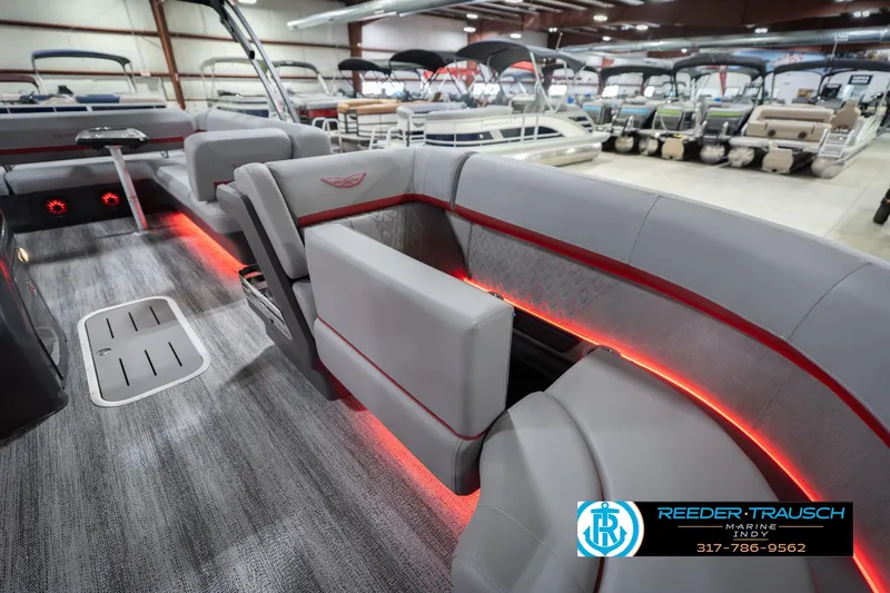 Slide: The Image of Interior of 2026 Bennington 22 ML boat with modern seating and ambient lighting. - 24