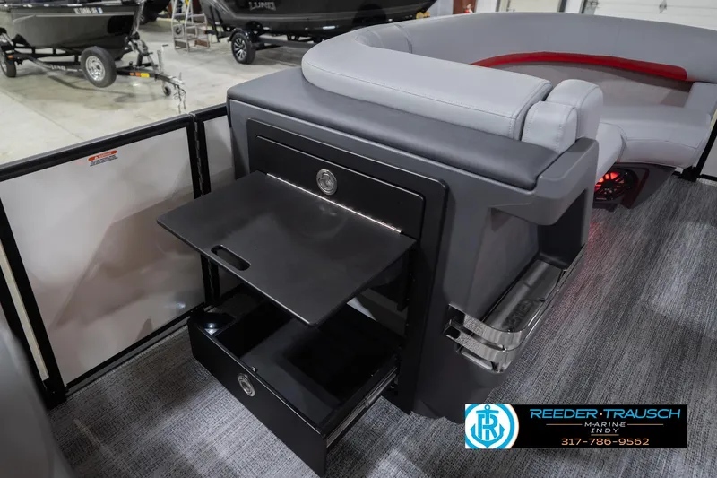 Slide: The Image of 2026 Bennington 22 ML boat interior with storage compartments and seating. - 28