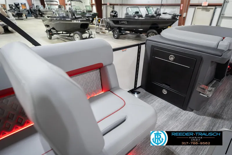 Slide: The Image of Interior of a 2026 Bennington 22 ML boat with modern seating and storage. - 32
