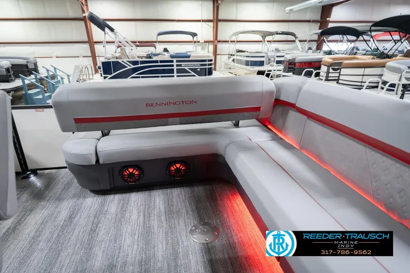 Slide: The Image of Luxurious 2026 Bennington 22 ML pontoon boat interior with stylish seating and ambient lighting. - 34