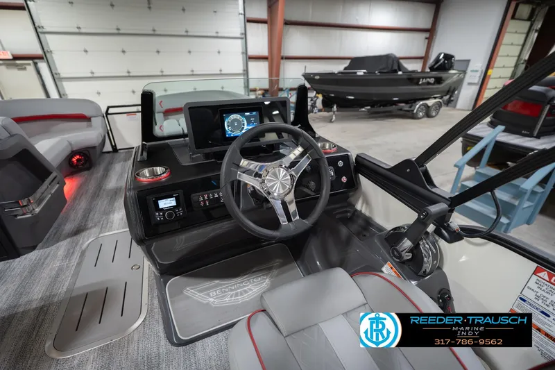 Slide: The Image of Interior of 2026 Bennington 22 ML boat with modern dashboard and steering wheel. - 38