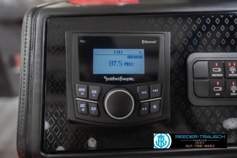 Slide: The Image of 2026 Bennington 22 ML dashboard with Rockford Fosgate PMX-1 stereo displaying 87.5 MHz. - 40