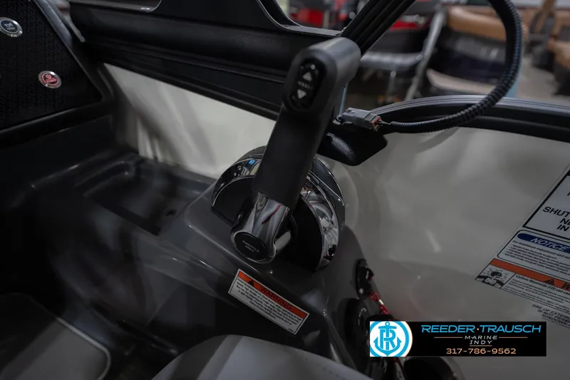 Slide: The Image of Control panel of a 2026 Bennington 22 ML boat with throttle lever. - 44