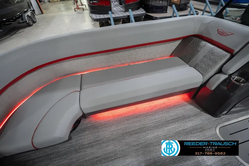 Slide: The Image of Luxurious seating with red LED lighting on a 2026 Bennington 22 ML boat. - 47
