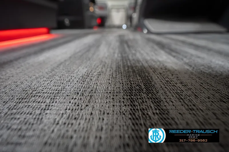 Slide: The Image of Close-up of 2026 Bennington 22 ML boat flooring with textured design and ambient lighting. - 53