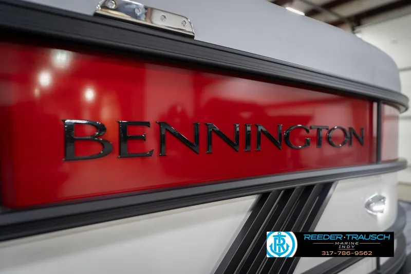Slide: The Image of 2026 Bennington 22 ML boat with red and black detailing, Reeder-Trausch Marine logo. - 55