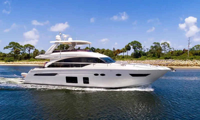 The Image of 2015 Princess Flybridge 68 Motor Yacht on water, city skyline. - 0