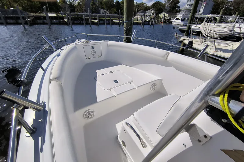 Slide: The Image of 2003 Century 2600 Center Console boat interior at a marina dock. - 11