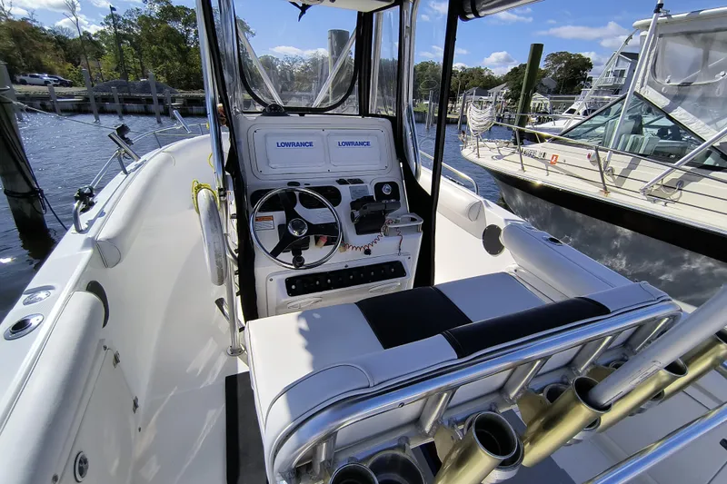 Slide: The Image of 2003 Century 2600 Center Console boat interior with steering wheel and Lowrance equipment. - 5