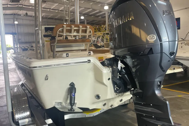 Slide: The Image of 2026 Key West 210 Bay Reef boat with Yamaha outboard motor in showroom. - 11
