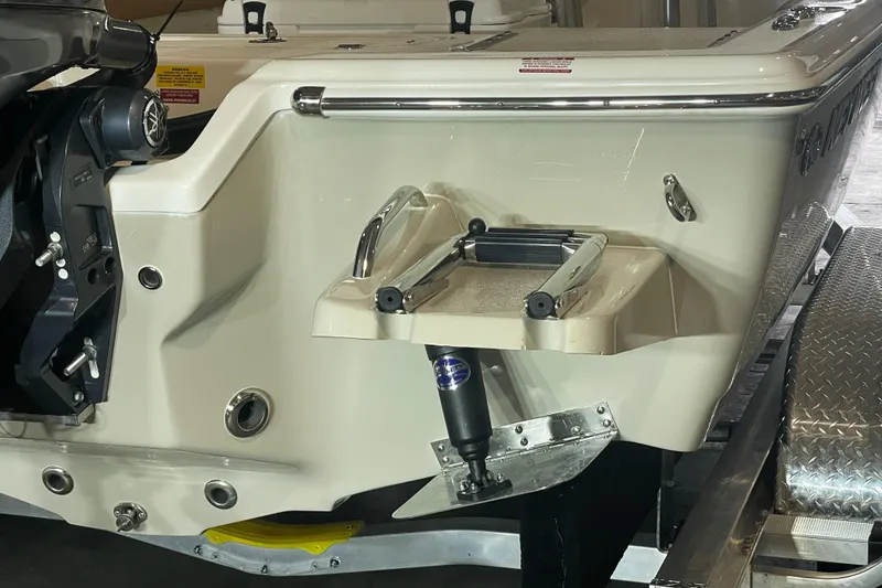 Slide: The Image of 2026 Key West 210 Bay Reef boat stern with motor and trailer detail. - 12