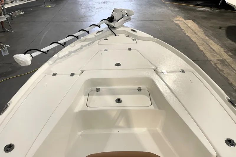 Slide: The Image of 2026 Key West 210 Bay Reef boat deck with mounted equipment in a showroom. - 16