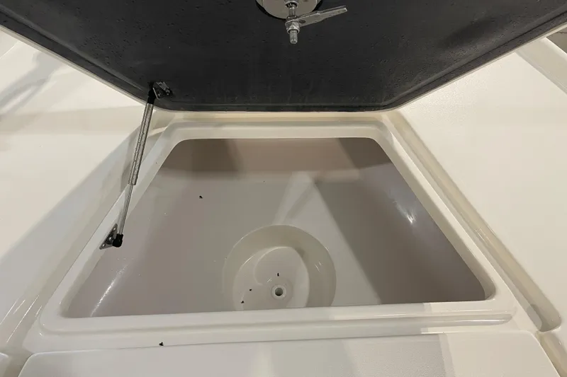 Slide: The Image of Open storage compartment on 2026 Key West 210 Bay Reef boat. - 21