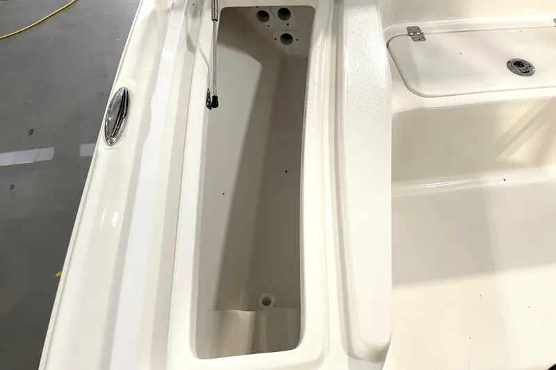 Slide: The Image of 2026 Key West 210 Bay Reef boat storage compartment, open and empty. - 22