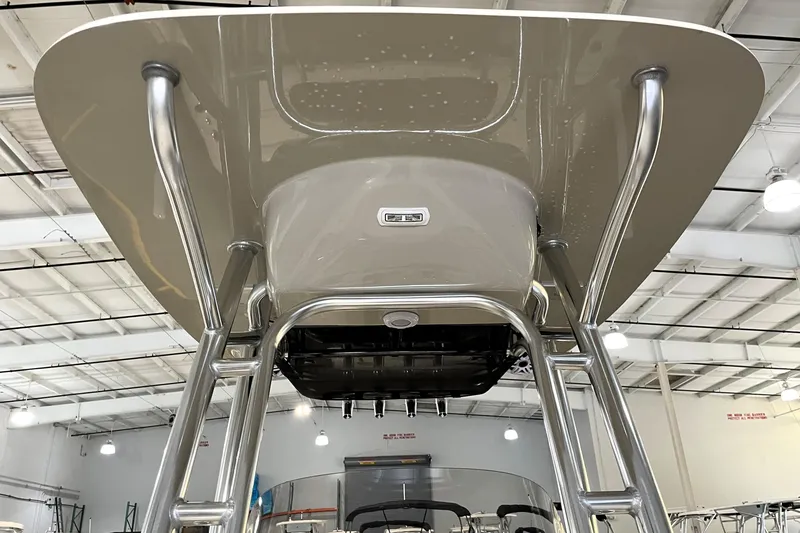 Slide: The Image of 2026 Key West 210 Bay Reef boat T-top structure in a showroom. - 26