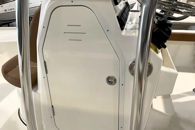 Slide: The Image of 2026 Key West 210 Bay Reef boat console with stainless steel railings and storage compartment. - 29