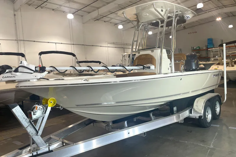 Slide: The Image of 2026 Key West 210 Bay Reef boat on trailer in indoor showroom. - 3