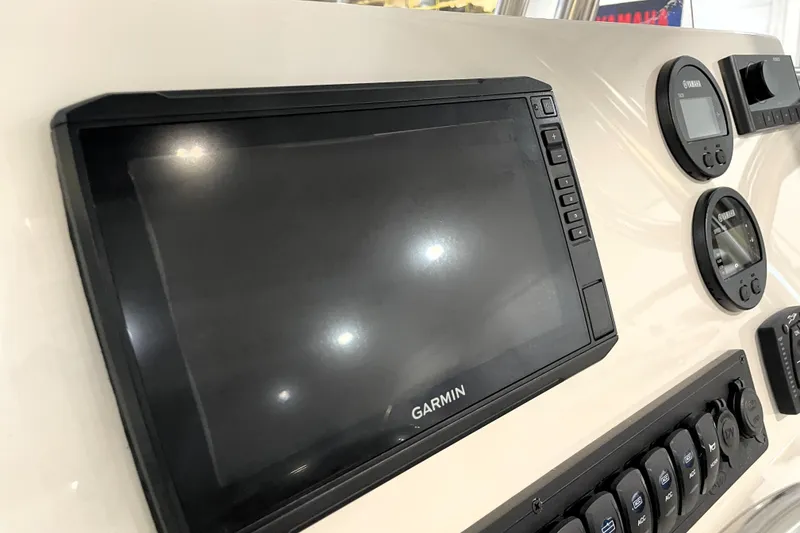 Slide: The Image of Dashboard of 2026 Key West 210 Bay Reef with Garmin display and controls. - 33