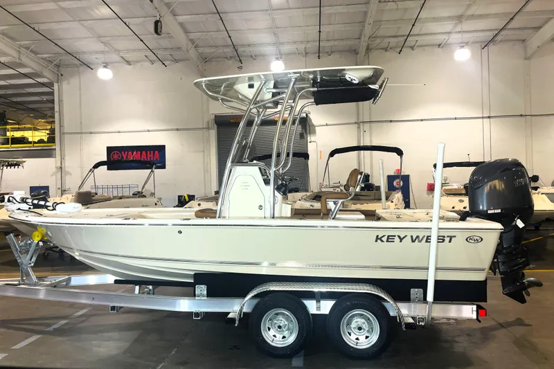 Slide: The Image of 2026 Key West 210 Bay Reef boat on trailer in indoor showroom. - 4
