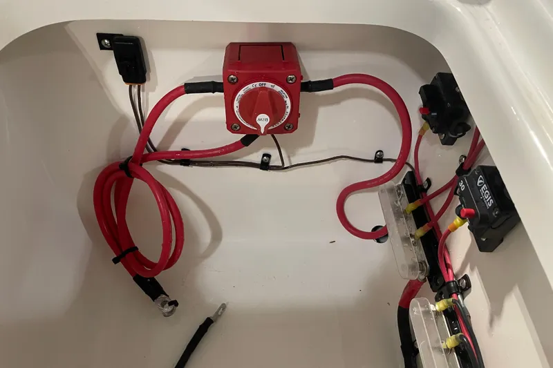 Slide: The Image of Electrical wiring setup in a 2026 Key West 210 Bay Reef boat compartment. - 43