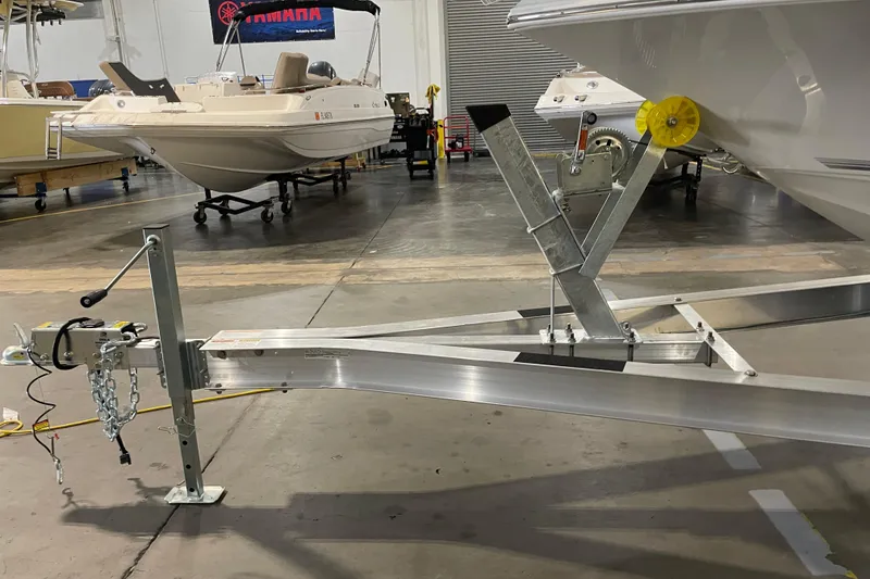 Slide: The Image of Boat trailer with Key West 210 Bay Reef, 2026 model, in a showroom setting. - 45