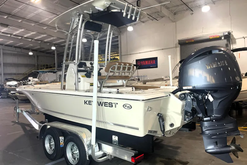 Slide: The Image of 2026 Key West 210 Bay Reef boat with Yamaha engine in showroom. - 5