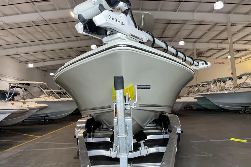 Slide: The Image of 2026 Key West 210 Bay Reef boat in showroom, front view on trailer. - 7