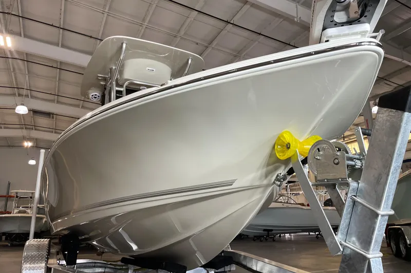 Slide: The Image of 2026 Key West 210 Bay Reef boat in showroom, front view on trailer. - 8