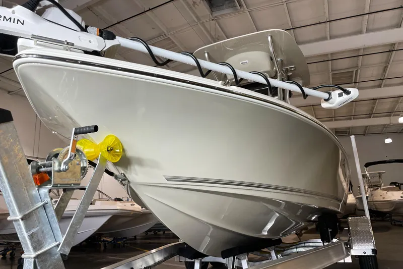 Slide: The Image of 2026 Key West 210 Bay Reef boat on trailer in indoor showroom. - 9