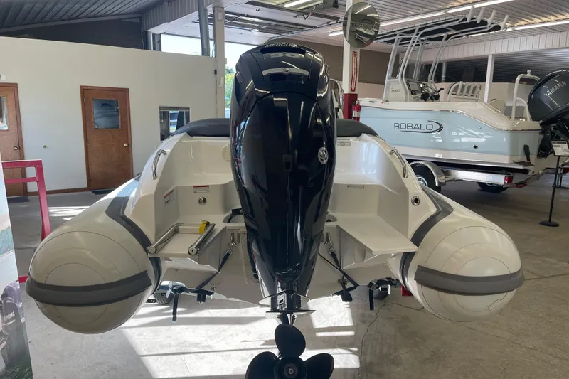 Slide: The Image of 2022 Walker Bay Venture 16 boat with Mercury engine in showroom. - 7