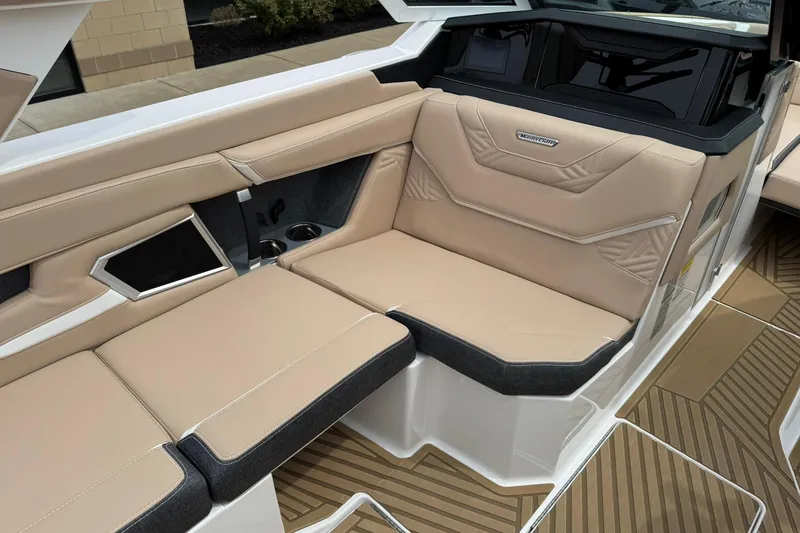 Slide: The Image of Luxurious interior seating of 2025 MasterCraft XStar 23 boat with beige upholstery. - 12