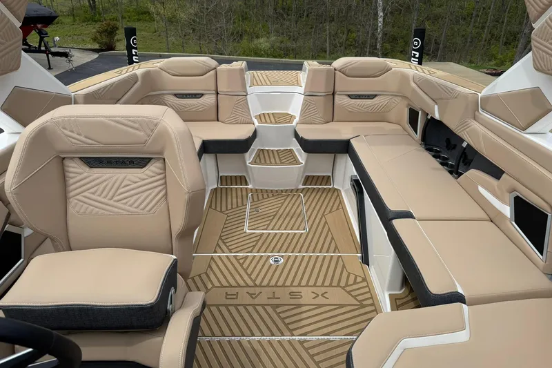 Slide: The Image of Luxurious interior of 2025 MasterCraft XStar 23 boat with beige seating and stylish design. - 13