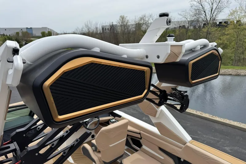 Slide: The Image of 2025 MasterCraft XStar 23 boat speakers with sleek black and gold design. - 15