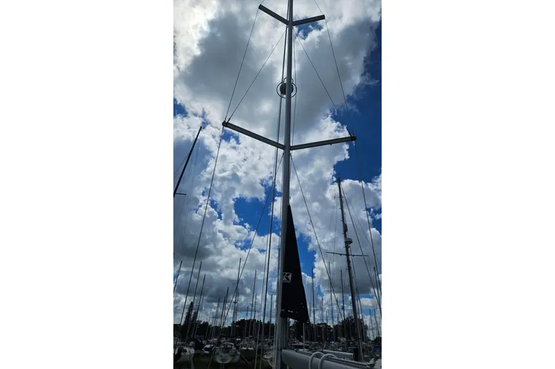 Slide: The Image of Mast of 2003 Beneteau Oceanis Clipper 393 sailboat against cloudy sky. - 10