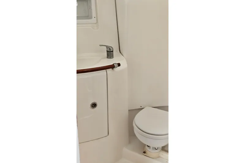 Slide: The Image of Bathroom interior of 2003 Beneteau Oceanis Clipper 393 yacht, featuring sink and toilet. - 19