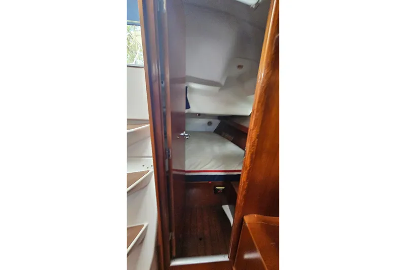Slide: The Image of Interior cabin of 2003 Beneteau Oceanis Clipper 393 sailboat, featuring wooden finishes. - 25