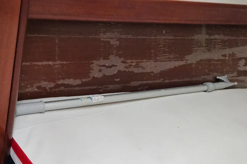 Slide: The Image of Interior of 2003 Beneteau Oceanis Clipper 393 with wooden paneling and white surface. - 32