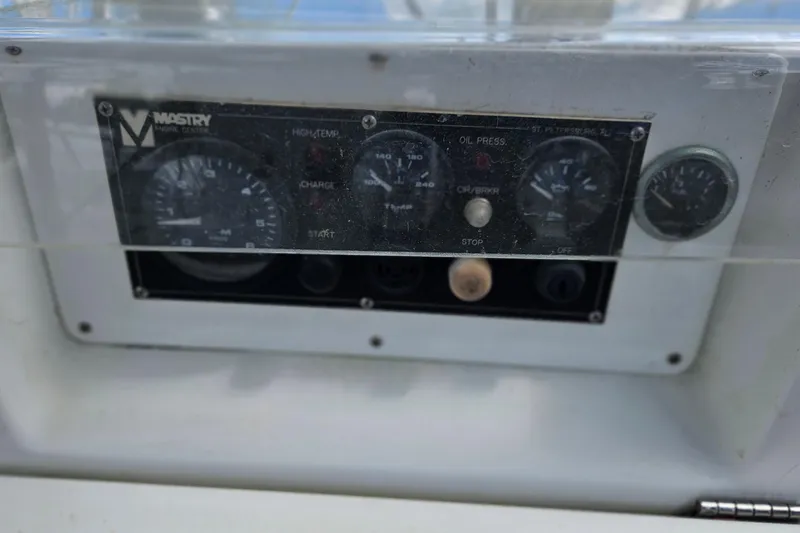 Slide: The Image of Control panel of a 2003 Beneteau Oceanis Clipper 393 sailboat, featuring engine gauges. - 5