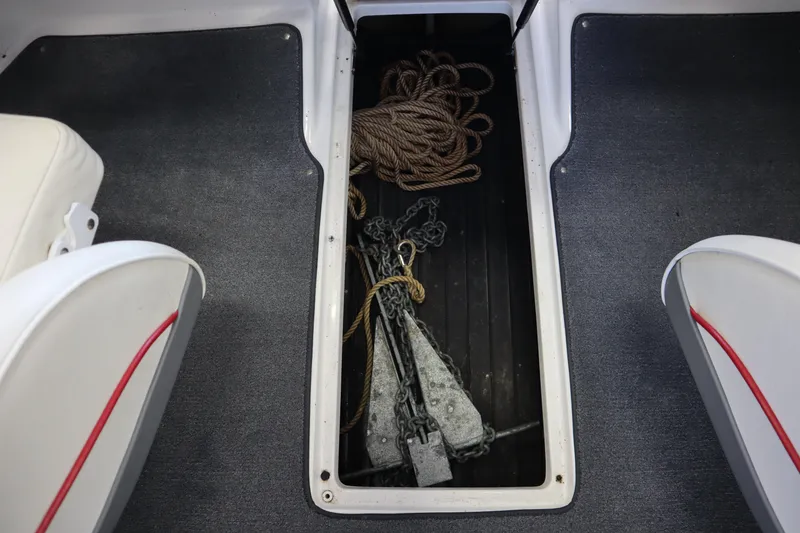 Slide: The Image of Storage compartment in 2006 Cobalt 220 boat with anchor and rope. - 15