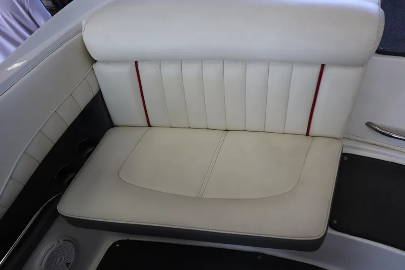 Slide: The Image of White leather seat in a 2006 Cobalt 220 boat interior. - 18
