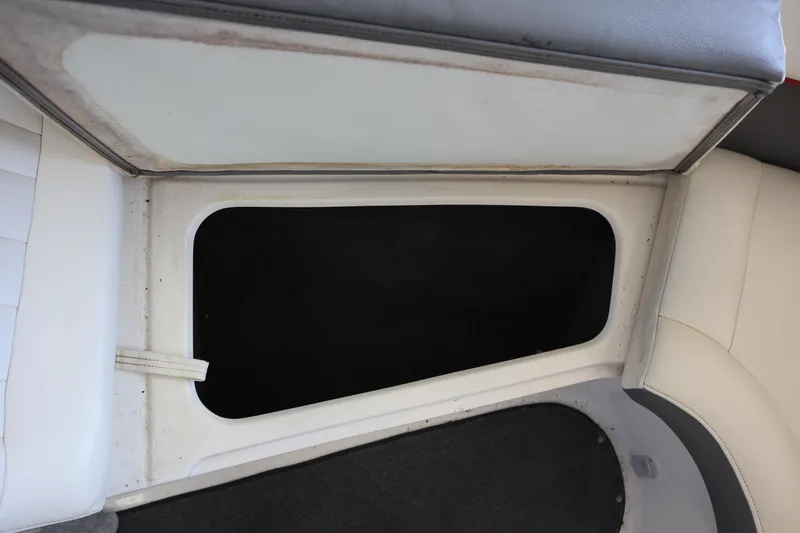 Slide: The Image of Open storage compartment in 2006 Cobalt 220 boat interior. - 5