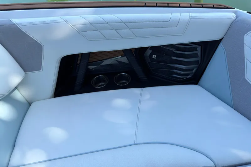 Slide: The Image of 2022 Nautique Super Air Nautique G23 Coastal Edition interior seating with speaker detail. - 10