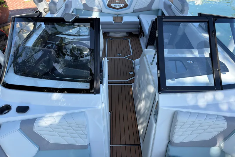Slide: The Image of 2022 Nautique Super Air Nautique G23 Coastal Edition interior with sleek design and premium seating. - 11