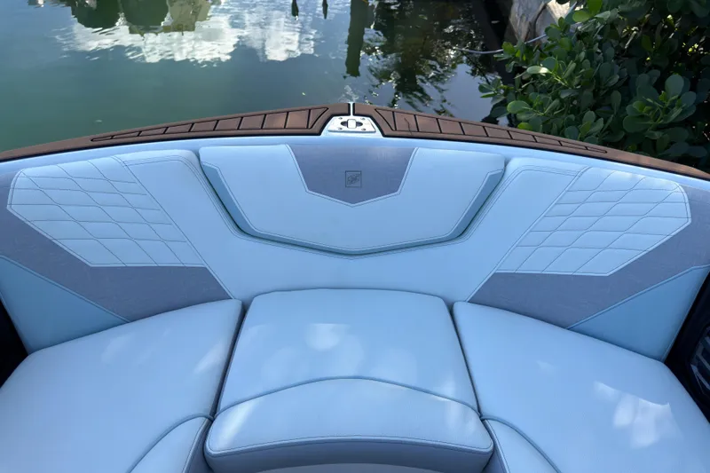 Slide: The Image of 2022 Nautique Super Air Nautique G23 Coastal Edition boat interior with blue upholstery. - 12